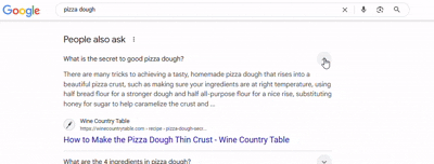 Clicking one PAA question box reveals more